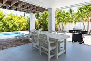 Downstairs covered living area with dining table