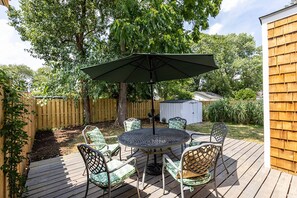 Soak in the sunshine on the spacious back deck with seating for 6.