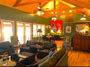 Large living room with wood burning fireplace and comfortable seating.