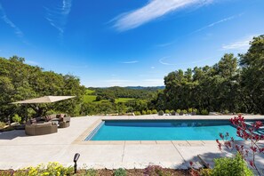 Relax poolside and soak up the sun in the ample outdoor living spaces.