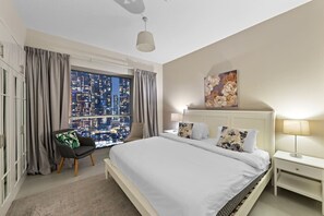 Bedroom: Dreamy nights await with stunning skyline views and elegant decor!