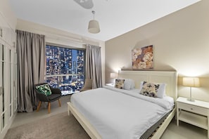 Bedroom: Dreamy nights await with stunning skyline views and elegant decor!