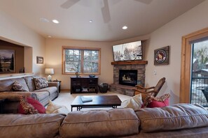 Main Living Space - TV, Gas Fireplace and Deck