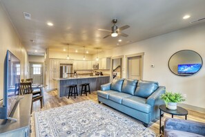 Our open-concept condo fosters relaxation with interconnected living, dining, and kitchen areas, offering space to unwind and move freely.