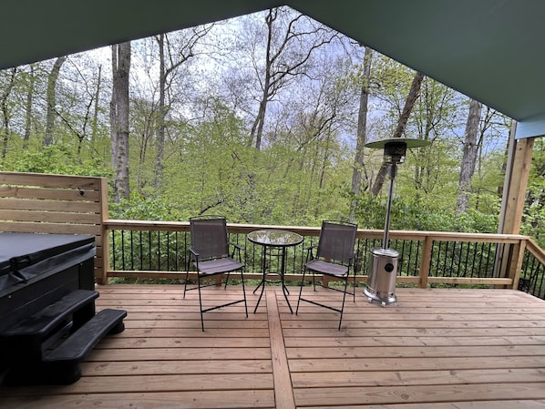 Enjoy the large deck overlooking the woods.
