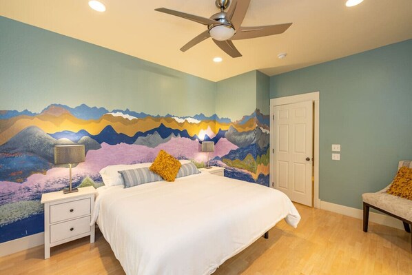 Sink into a soft bed in this beautifully painted bedroom for a great nights sleep.