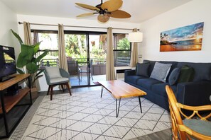 Relax in this tropical inspired living room with ocean breezes and island charm.