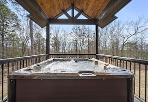 Enjoy the serenity of nature from the warmth of the hot tub, a view that's yours to savor