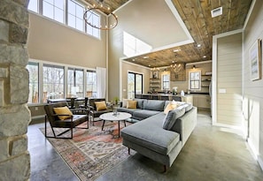 Step into a space where high ceilings meet chic comfort, the perfect setting to relax and recharge.