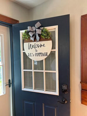 Door for entering the home, off the kitchen, key pad for entry 
