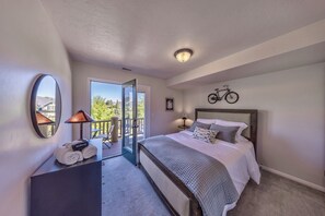 Queen bedroom located on main floor with private balcony.