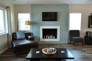 Living room with candles for ambiance and plenty of comfortable seating