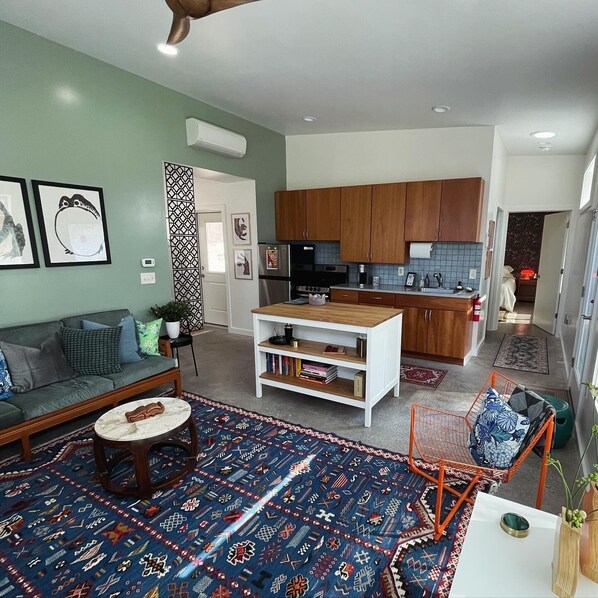 Living room with full kitchen
