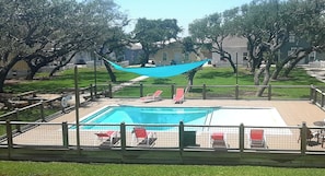 View of pool from upstairs bedroom