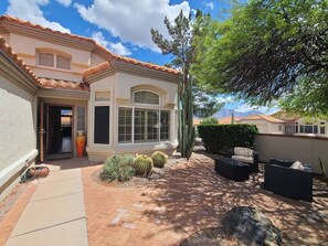 Upon entering the front gate, you'll step into our inviting courtyard, adorned with cozy outdoor seating. Here, you can bask in the desert air and soak in the majestic mountain views.