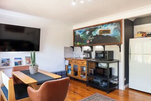 Combined kitchenette, lounge and dining area at Clear View Farm, Urban Farm Stay
