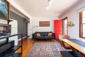 Combined kitchenette, lounge and dining area at Clear View Farm, Urban Farm Stay