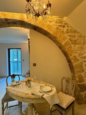 Romantic dinner for two beneath original medieval archway
