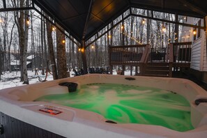 Relax in our peaceful hot tub, surrounded by nature