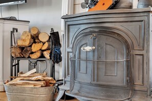 Wood burning stove with wood and kindling provided