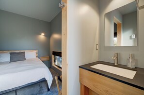 view of bedroom and ensuite bathroom