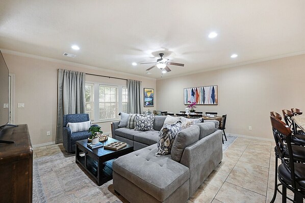 Abundant seating in living room ensures comfort for all guests.