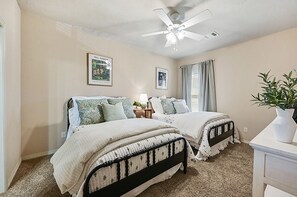 Two full beds, private bath provide comfort and privacy for guests.