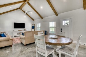 Alternative view of dining area and living room space.