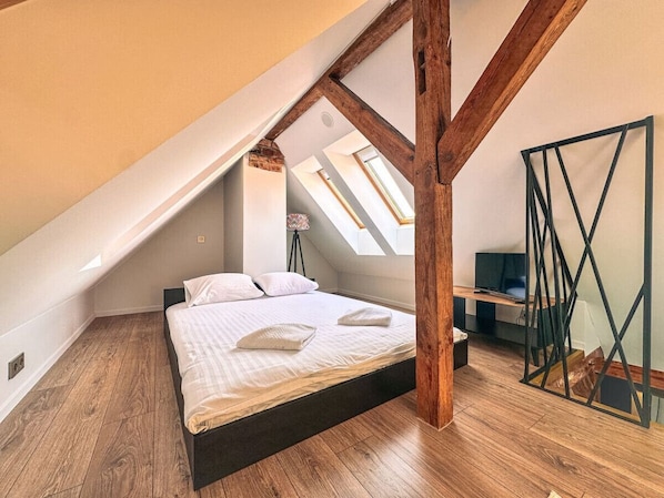 Loft area with a bed