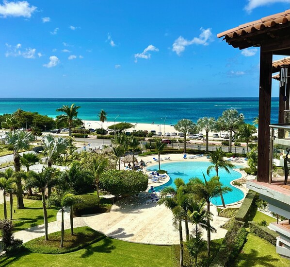 View of pool and Eagle Beach from your private balcony