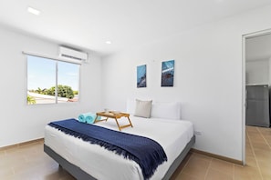 Our bedroom boasts a spacious king bed adorned with plush bedding, offering the perfect place to rest and rejuvenate after a day of adventure.