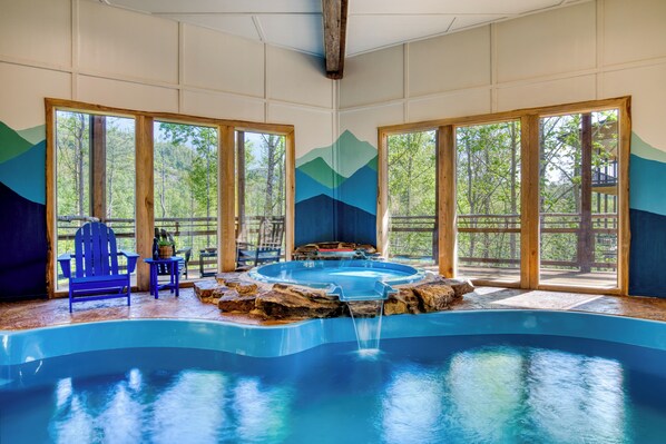 An indoor pool and hot tub, create an oasis within your mountain cabin retreat.