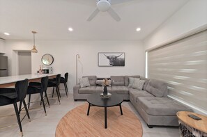 Sectional has a pull down back rest that turns into two cup holders for your convenience