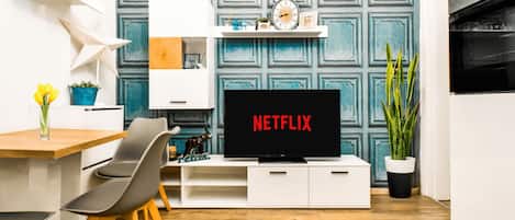 Chic meets comfort in this cozy dining and entertainment space, with streaming-ready smart TV and an inviting table for intimate meals or casual working.
