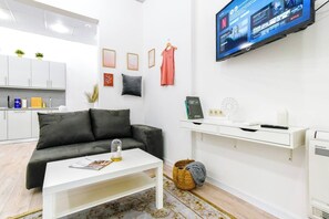 Relax in the cozy living room that’s perfect for lounging after a day of exploring Sofia. The comfortable seating area, complete with a plush sofa, provides the ideal spot to unwind while enjoying your favorite shows on the flat-screen smart TV with Netflix. Whether you’re catching up on work or having a meal at the dining area, this multi-functional space will make your stay feel like home.