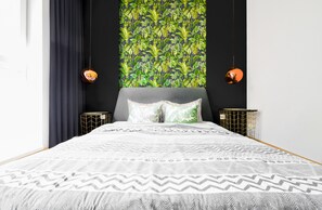 Dream in Serenity! Escape to this peaceful bedroom featuring lush botanical wallpaper, soft textiles, and blackout shades for the ultimate restful sleep. Recharge your energy to explore Sofia’s vibrant sights! Book Now for your tranquil retreat!