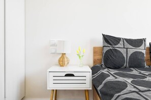 Tranquil retreat: A serene bedroom with a plush king-size bed, soft linens, and calming colors for restful nights.