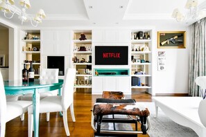 Luxury meets leisure: Relax or entertain in a living room designed for both tranquility and social gatherings.
