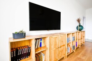 You’ll kick back and catch up on your favorite shows on the large flat-screen TV. Settle in and make movie nights a part of your stay.