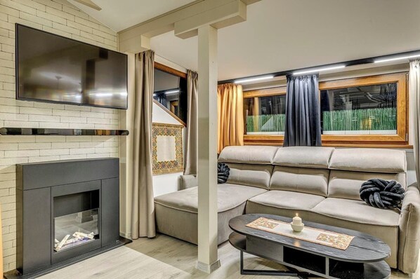 Relax in this spacious living area – perfect for unwinding after exploring Sofia! 🌆 Book Now for Your Cozy Getaway!