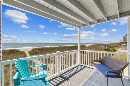 Sit on balcony and view miles of beach and ocean