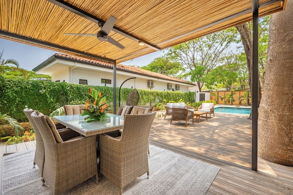 Dine al fresco under the shade to take in the lush surroundings and warm breeze.