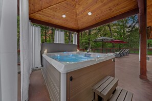 Forget your cares in this hot tub surrounded by the beauty of the Broken Bow woods.