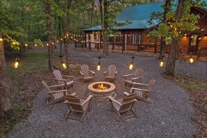 The cabin has a cozy fire pit, perfect for trading stories under the stars.