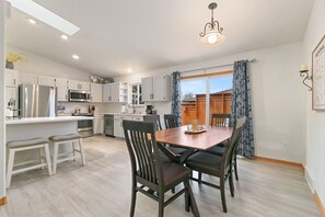 Kitchen and Dining Area | Access to the Back Deck and Side Patio (main level)