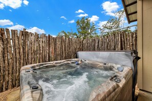 Enjoy a soak in the private hot tub.