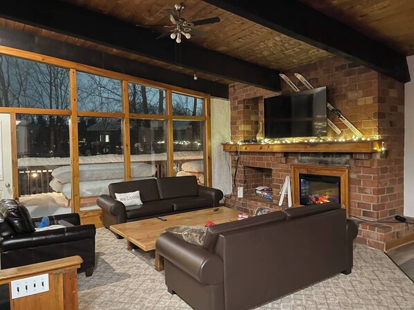 Living Room (upper level) with access to Balcony and BBQ