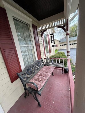 Side porch with side door to left of photo
