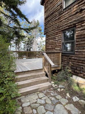 The side porch leads to the front yard.