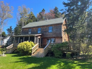 This beautiful log home is perched perfectly above the Atlantic Coast.